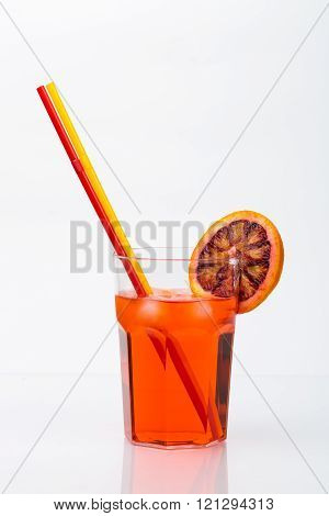 Aperol spritz aperitif alcoholic cocktail with orange slices and ice cubes isolated on white backgro
