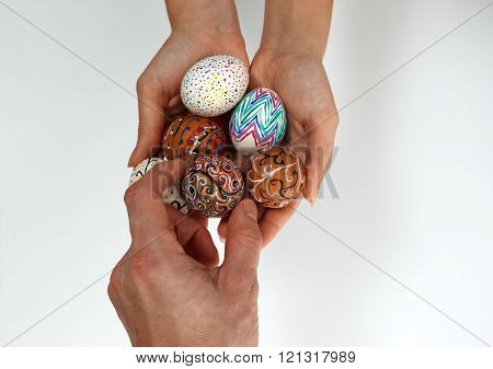 Colorful Easter Eggs On Burlap, Female Hand Chose And Pick One Egg