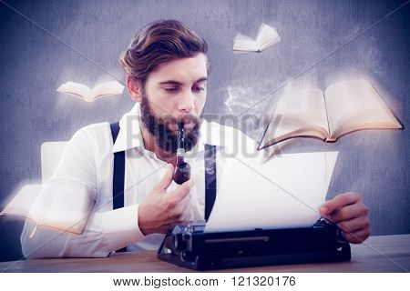 Hipster with smoking pipe working on typewriter against white and grey background