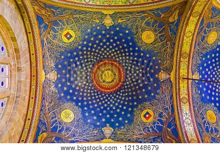 JERUSALEM ISRAEL - FEBRUARY 16 2016: The bright blue dome in Church of All Nations showing the night sky over Gethsemane garden with the old olive trees in corners on February 16 in Jerusalem.
