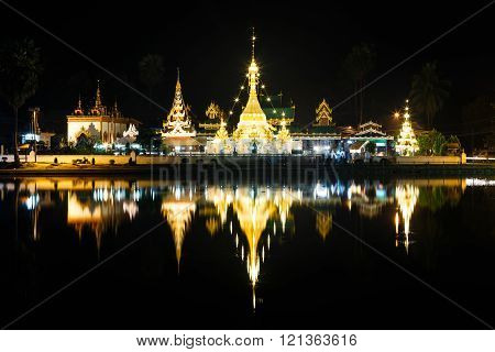 Wat Jong Klang and Wat Jong Kham at night with market in Mae Hong Son ,Thailand