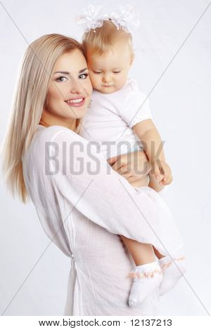 Young mother with her baby studio shot