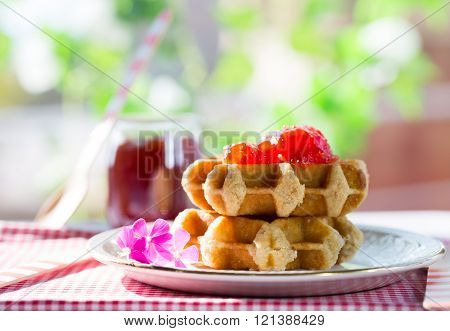 Delicious homemade waffles for breakfast prepared with raspberries