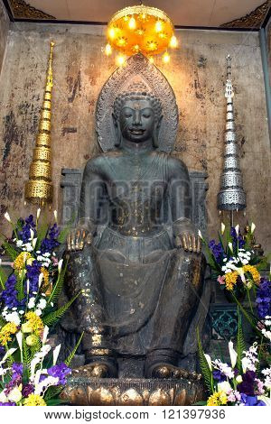 AYUTTHAYA,THAILAND-FEBRUARY10,2010 : Phra Khan Thavarat an approximately 5.20 meters high statue made of dark green stone,which from the Dvaravati comes period, Wat Na Phra Meru,Ayutthaya Historical Park of Thailand.