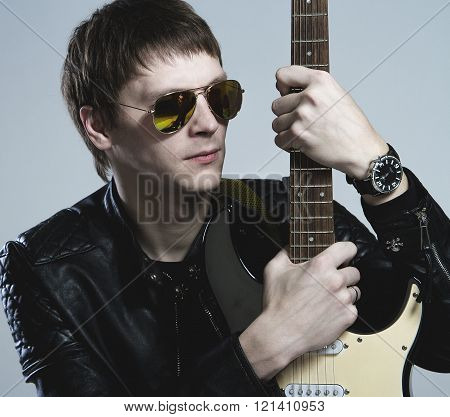 The guy with the guitar in my thoughts about music, Muse and love.