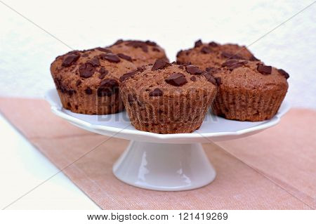 Chocolate Muffins On The White And Pink Background