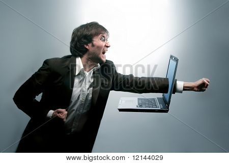 A man breaking a notebook