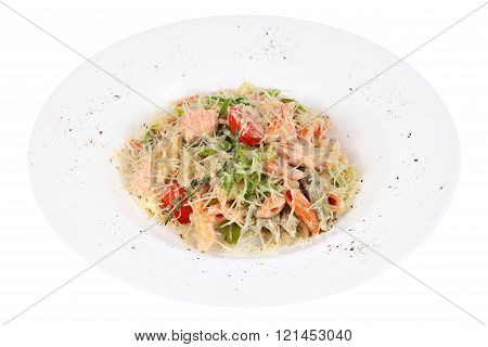 Serve Pasta With Red Fish And Vegetables On White Plate.