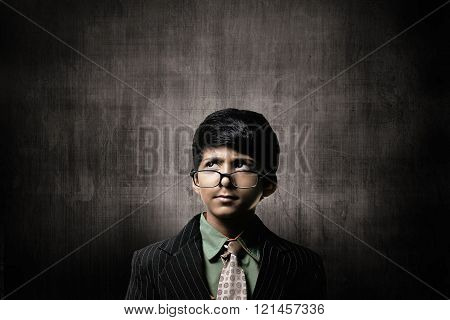 Genius Little Boy Wearing Glasses, Thinking Near Chalkboard