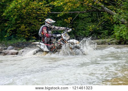Motorcycle Enduro Moved Across The River In The Forest