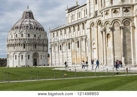 Piza, Italy - 10 March, 2016: View Of Leaning Tower And The Basilica, Piazza Dei Miracoli, Pisa, Ita