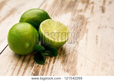 Lime  And Mint Leaf On A Table