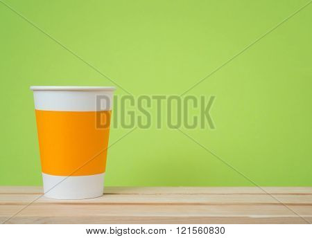 Paper cup with Sleeve on green background