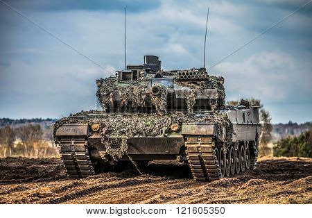 main battle tank stands in position to shoot