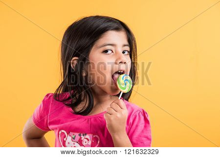 indian small girl with lollipop or loly pop, asian girl and lollipop or lolypop