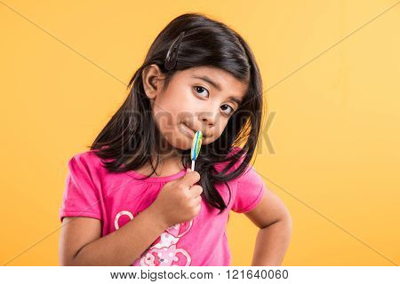 indian small girl with lollipop or loly pop, asian girl and lollipop or lolypop