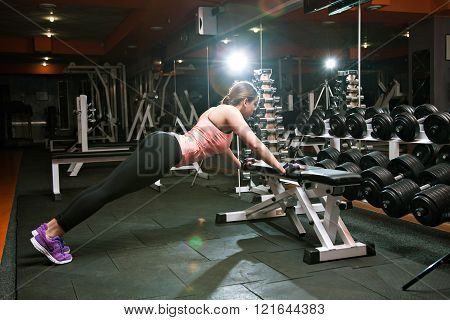 Fitness Woman Doing Push Up In The Gym