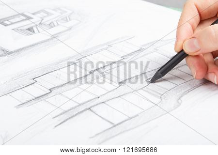 Architect working on blueprint. Architects workplace - architectural project, blueprints, ruler, cal