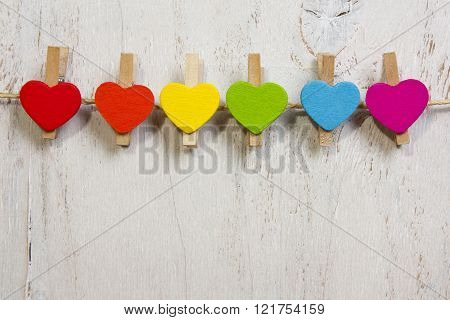 Heart Rainbow Of Colors On A White Wooden Background
