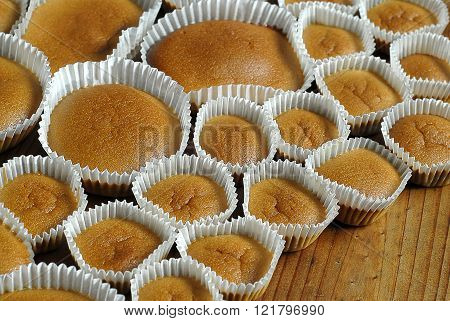 Homemade baked cupcakes on the wooden table