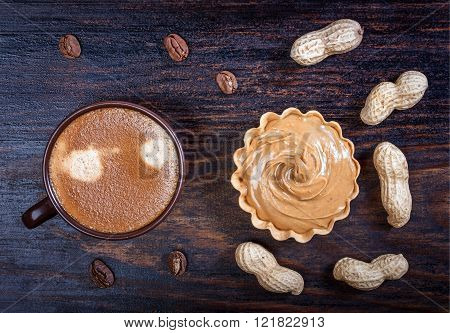 Espresso Coffee In A Ceramic Bowl, Basket Waffle With Peanut Butter, Peanuts, Coffee Beans On A Wood