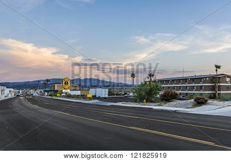 LAKE HAVASU USA - JULY 8 2008: freeway at the city limit of Lake Havasu ins the evening with a typical motel and mountains in the background.