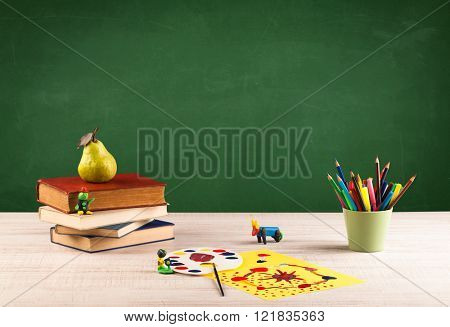 Back to school concepty with clear blackboard background, desk, items