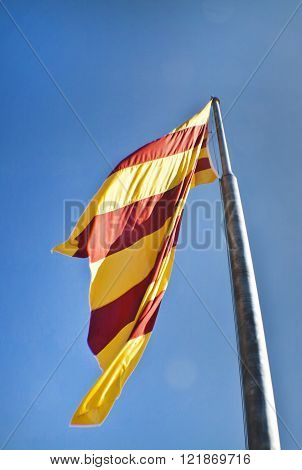 Catalan flag fluttering in the wind in Montjuic Castle