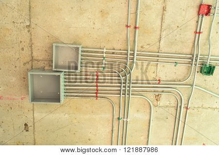 Electrical network installation on ceiling floor, Cable conduit.