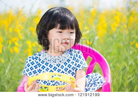 Cute Asian girl wearing white dress in yellow sunhemp flower field
** Note: Soft Focus at 100%, best at smaller sizes