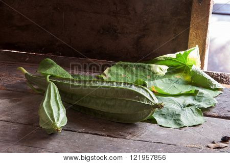 angled gourds fresh on vintage wooden background