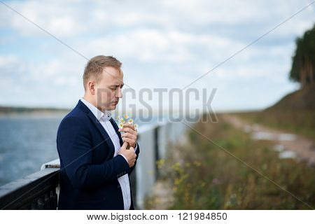 portrait of middle aged businessman walking in the nature