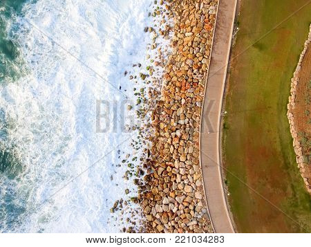 drone view of the beach with promenade and park