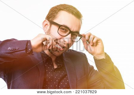 Handsome Young Man In Suit And Glasses Bite Bitcoin Cion Isolated On White Background. Tonned Image