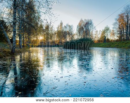 Beautiful Photo of a Frozen Lake in Sunny Autumn Day in an October