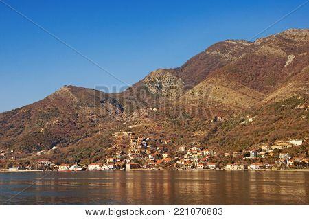 Brown and blue landscape.  Bay of Kotor (Adriatic Sea), Kamenari, Montenegro. Free space for text