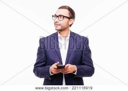 Side View Of Young Stylish Man In Jeans Using Mobile Phone Isolated Over White Background.