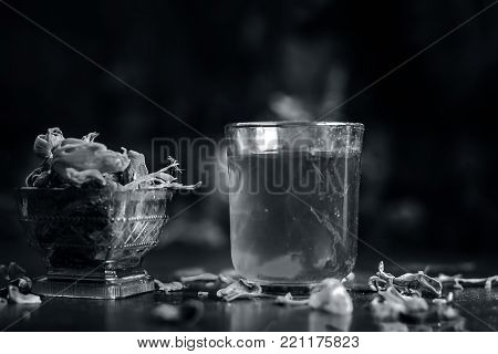 Close Up Of Water Of Mace,javantri Or Myristica Fragrans In A Glass With Raw Mace.