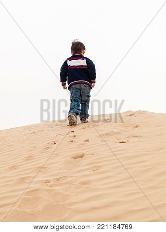 children playng whit the sand of desert,Douz;Tunisia