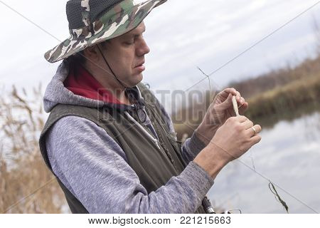 A man enjoys in the free time he spends himself on fishing