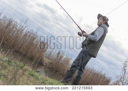 A man enjoys in the free time he spends himself on fishing
