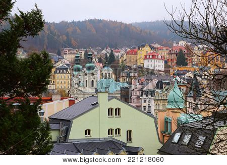 Cityscape with Saint Mary Magdalene church (Karlovy Vary). Famous Czech Spa Karlovy Vary (Karlsbad) in the late autumn time.
