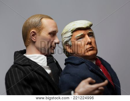 NEW JERSEY, USA - JAN 4 2018: Caricature of Russian President Vladimir Putin whispering into the ear of United States President Donald Trump - using toy action figures