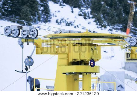 Mechanism of transportation cable lift on the snow mountain. Uludag the ancient Mysian Olympus and Bithynian Olympus, is a mountain in Bursa Province, Turkey. Ski lifts durings bright winter day.