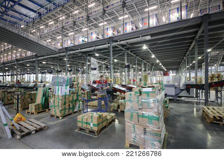TVER, RUSSIA - MAY 17, 2017: Workers in warehouse and sorting center of Ozon internet shop, it takes sixth place in list of most expensive russian internet companies 