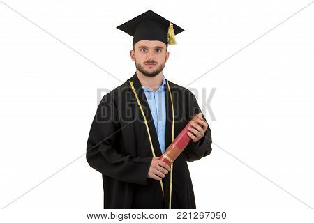 cheerful smiling male graduate wearing gown and cap isolated on white.