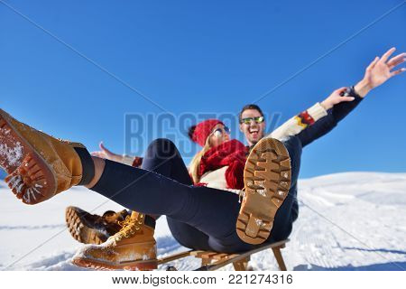 romantic winter scene, happy young couple having fun on fresh show on winter vacatio, mountain nature landscape.