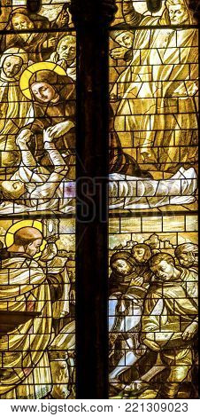 VENICE, iTALY - SEPTEMBER 21, 2017 Monks Saints Sick Stained Glass Altar Santa Maria Gloriosa de Frari Church San Polo Venice Italy.  Church completed mid 1400s.