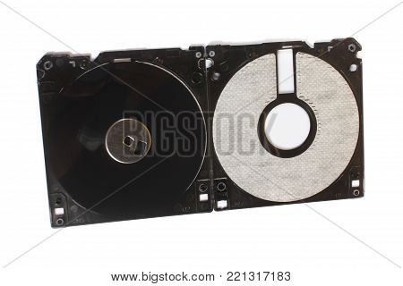 An old floppy used for storing data stripped down showing its magnetic disc.