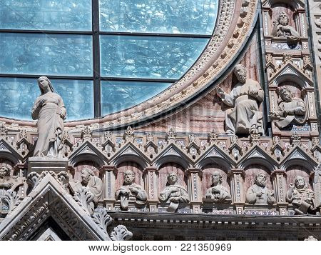 Detail of the upper facade of Siena cathedral with supltures of saint and philisophers